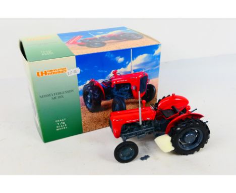 Universal Hobbie - Tractor. A boxed Universal Hobbies 1:16 scale model of a #UH2692  Massey Fergusson MF35X tractor. A very w