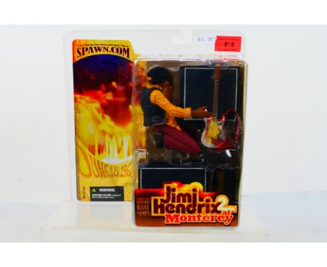 Spawn.com - McFarlane - Jimi Hendrix 2. A boxed, sealed Jimi Hendrix 2 At Monterey 2002 Model and scene with Guitar on 'Fire'
