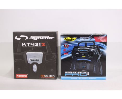 Kyosho - Two boxed RC control systems. Lot includes a Carson Reflex Stick Pro 3; with a Kyosho Syncro KT431S. Both appear Min