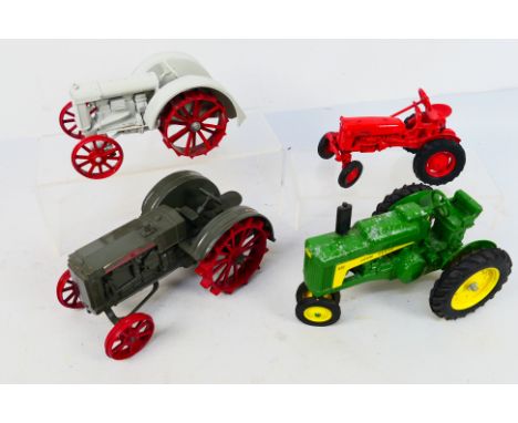 Ertl - Tractors. A selection of Four loose Ertl Tractors appearing in playworn to VG condition. Lot to include: McCormick, Fa