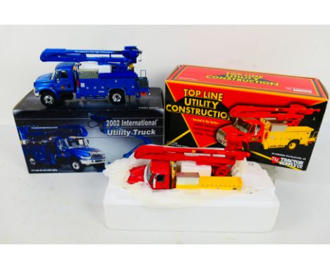 First Gear, TSC - 2 x boxed First Gear die-cast model trucks - Lot includes a die-cast 2002 International Utility truck. A TS