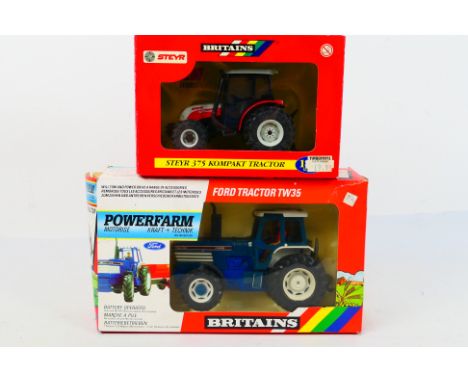 Britains. Two boxed Britains Tractors appearing in VG condition in Fair - Good boxes. #9321 Ford TW35 Tractor. #42023 Steyr 3