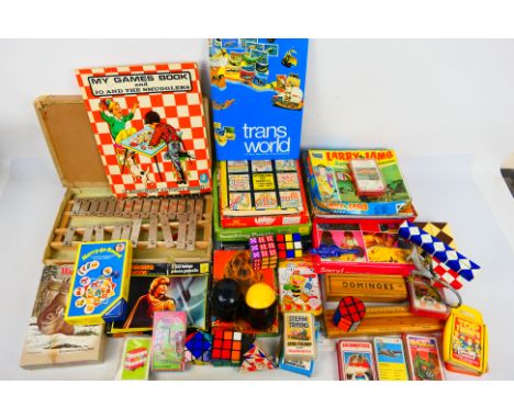 Waddingtons - Tomy - Parker Brothers - Other - A group of vintage children's games, jigsaws, toys and puzzles. Lot includes T