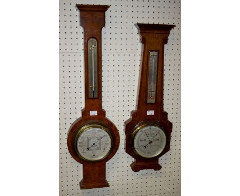 Three mid 20th century walnut and oak barometer thermometers, H74 to 57cm