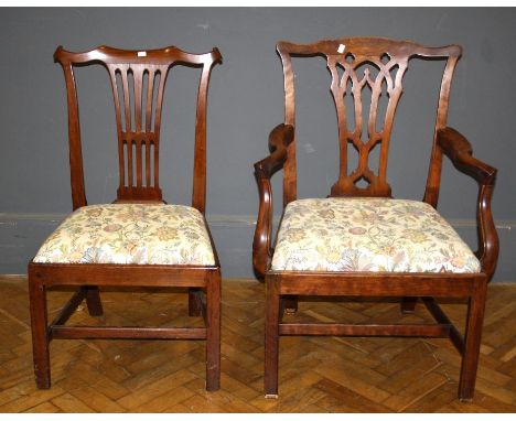 A George III walnut elbow chair in the Chippendale style having a pierced splat and slip in seat raised on square section leg