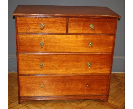 A late Victorian walnut chest, having two short and three long drawers fitted with ring handles, raised on bracket feet Gillo