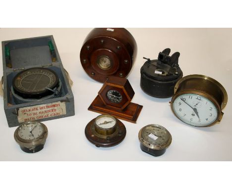 A clock mounted in a propeller boss, various clocks and a cased compass