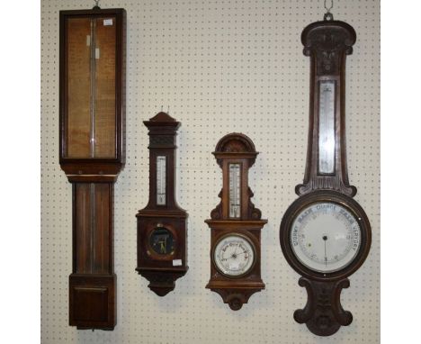 An Admiral Fitzroy type barometer, H95cm, an oak barometer thermometer H92cm, another smaller and another similar incomplete 