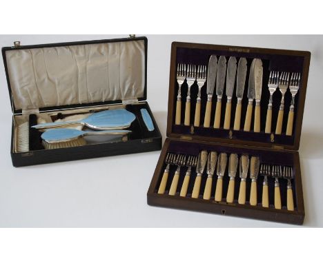 Adie Brothers, a cased five piece silver and sky blue enamel mirror and brush suite, Birmingham 1948, together with a cased s