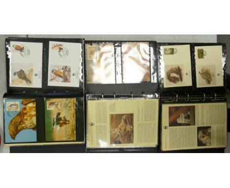 A collection of WWF first day cover stamp albums: comprising three full leather bound albums full of first day stamp covers f