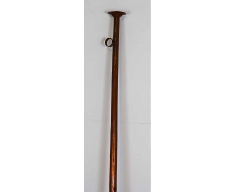 Constructed of copper, this display hunting horn has an incised colored design at the flared bell. Length: 61 3/4 in. Mouth W