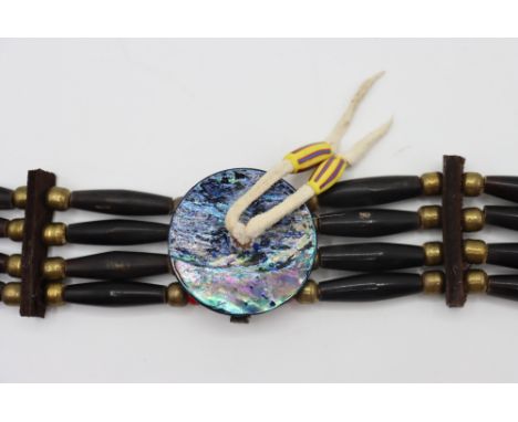 Southwestern American Indian vintage 4-strand hairpipe choker comprised of metal, wood, and glass beads with a central disc o