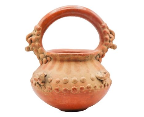 Low fire ceramic vessel with handle, slip and decorative additions, in the style of Pre-Columbian ware.Size: 7 1/2 x 6 in. Pl
