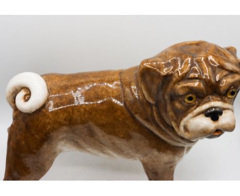Italian ceramic pug painted finish. In the upright standing position with alert eyes. Size: 10 1/2 x 15 x 8 in.