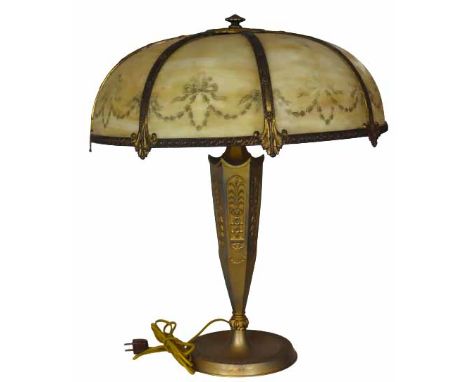 Exquisite panel lamp comprised of eight curved opaque stained glass panels that have been lightly painted/stenciled on the ou