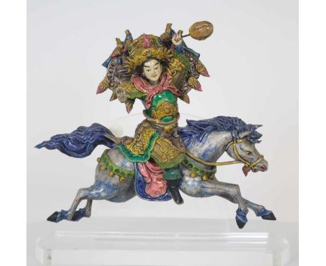 Costumed warrior on a running horse.  Ceramic tiles such as this one have been placed on Chinese temple roofs for centuries t