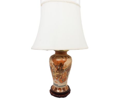 Japanese satsuma vase mounted as a table lamp. Adult and children figures. Size: 28 x 11 in.Please note that all sales are fi