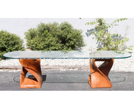 Long glass top oval coffee table with wooden stool legs.Two stools included, each of different height: 23 in high and 18 in h