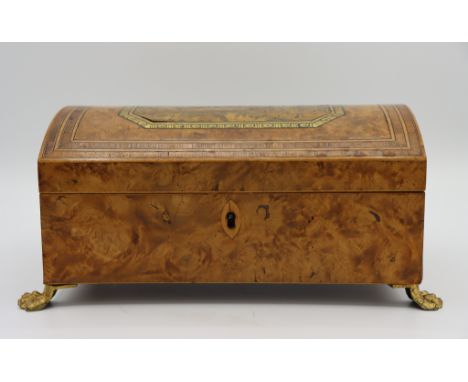 Wooden Tea Caddy with slightly convex hinged lid, and metal claw feet. Image on box depicts Marine Parade and Library, Bright