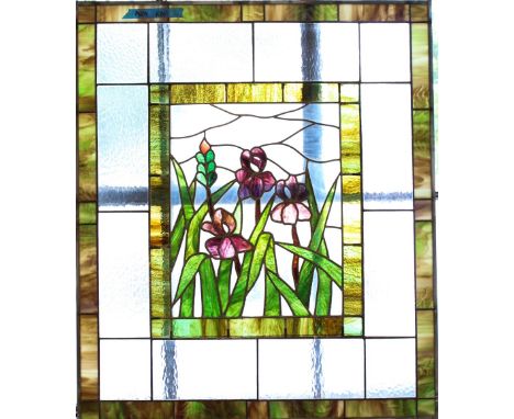 Flower glass art panel, purple irises in central panel, surrounded by green milk glass border followed by textured or pebbled