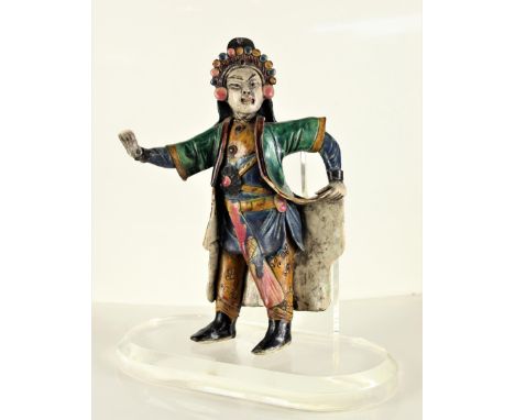 Standing figure with robe. Ceramic tiles such as this one have been placed on Chinese temple roofs for centuries to ward off 
