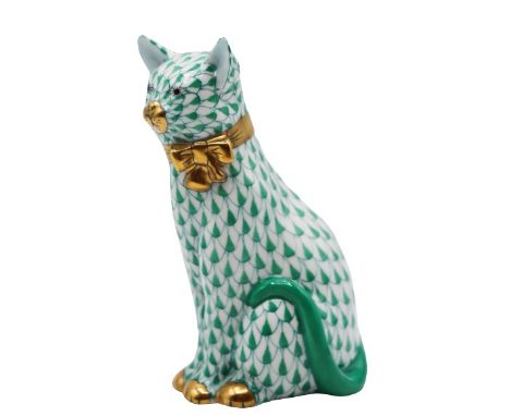 Ceramic figurine of a contented sitting cat, hand-painted with green design and gold details. Mark on bottom. Size: 4 1/2 x 3