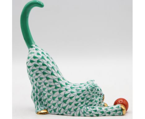Ceramic kitten playing with a ball, green patterned design. Mark on bottom. Size: 5 x 4 1/2 x 1 1/2 in.