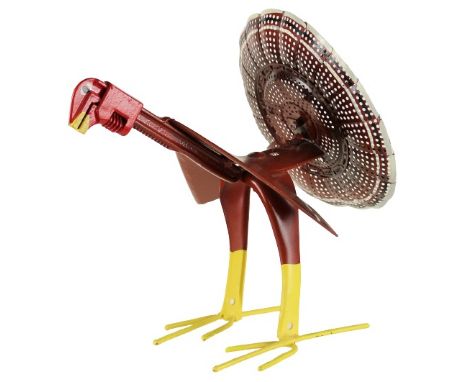 Folk art bird, made from re-purposed or recycled tools and utensils.  This sweet turkey has a wrench face and a tail made fro