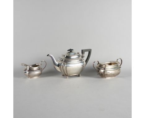 A SILVER TEAPOT, A SILVER SUGAR BOWL AND A SILVER  MILK JUG (3)The teapot raised on four spherical feet, with black fittings,
