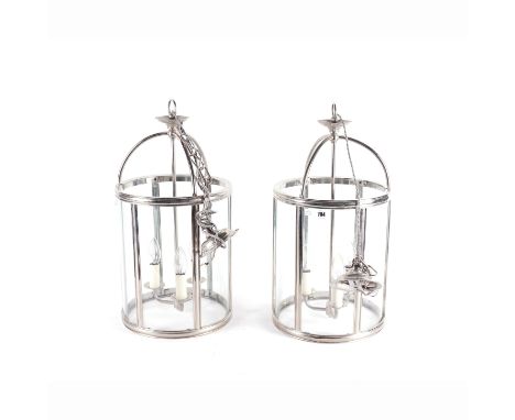 A PAIR OF MODERN CHROME PLATED AND GLASS THREE LIGHT CYLINDRICAL CEILING LANTERNS (2)Each 54cm high; 30cm diameter