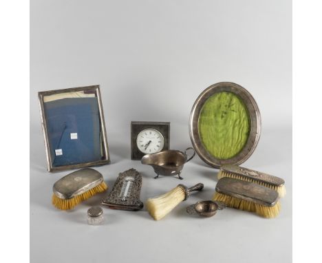 A GROUP OF SILVER AND SILVER MOUNTED WARES (11)Comprising; an oval photograph frame, Birmingham 1912, a rectangular photograp
