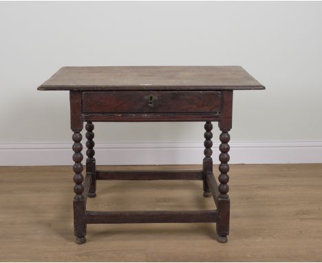 A 17TH CENTURY OAK SINGLE DRAWER SIDE TABLEOn bobbin turned supports, 97cm wide; 60cm deep; 71cm high