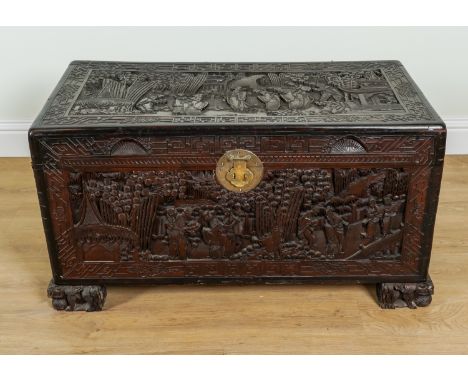 AN EARLY 20TH CENTURY EASTERN EXPORT EXTENSIVELY CARVED CAMPHOR WOOD TRUNK100cm wide; 50cm deep; 55cm high