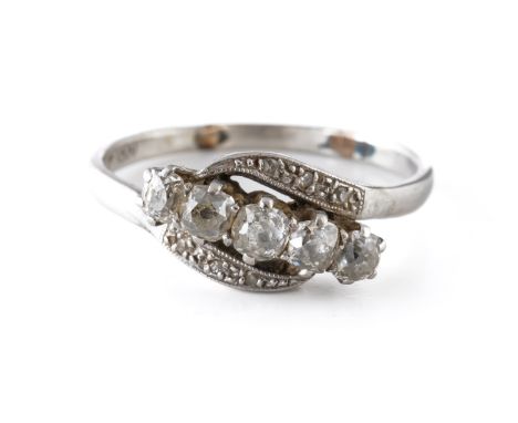 A PLATINUM AND DIAMOND RINGClaw set with a row of old cut cushion shaped diamonds, between diamond three stone shoulders, in 