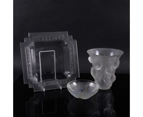 THREE ITEMS OF LALIQUE GLASSCirca 1930 Comprising; a `Saint Francois' frosted glass vase, 17cm high; a `Paquerettes' shaped s