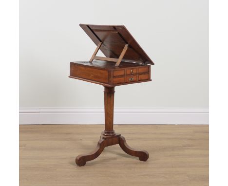 A GEORGE III FEATHER BANDED MAHOGANY ANGLE ADJUSTABLE TWO DRAWER WRITING TABLEOn unusual Manx style tripod base, 49cm wide; 4