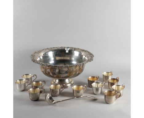 A LARGE SILVER PLATED PUNCH BOWL, LADLE AND TWELVE PUNCH CUPS (14)The punch bowl decorated with a border of fruiting vine, di