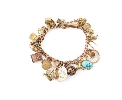 A 9CT GOLD CURB LINK BRACELET FITTED WITH TWENTY-TWO PENDANTS AND CHARMSIncluding; a 9ct gold cased ten shilling note, a gold