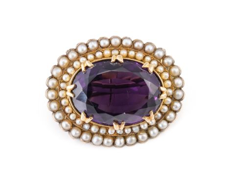 A VICTORIAN GOLD, AMETHYST AND HALF PEARL SET OVAL BROOCHClaw set with the oval cut amethyst within a two row surround mounte
