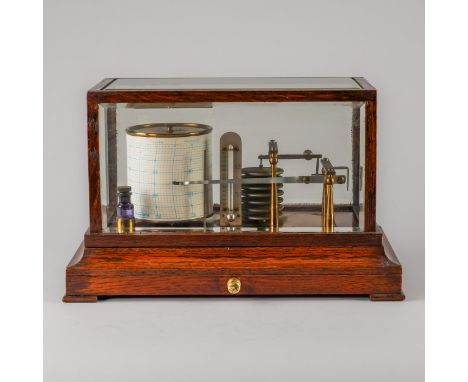 AN EDWARDIAN OAK GLAZED BAROGRAPHTurnbull & Co, Princes Street, Edinburgh With five bevelled panels, the mechanism on a brass