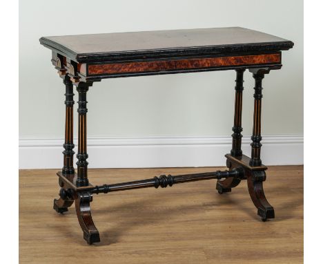 GILLOW AND CO; A MID 19TH CENTURY PARCEL GILT AMBOYNA AND EBONISED RECTANGULAR FOLD OVER CARD TABLEOn four downswept supports