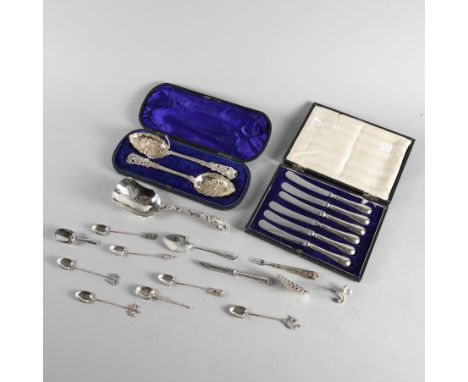 A GROUP OF SILVER, FOREIGN AND PLATED FLATWAREComprising; a pair of plated Victorian fruit serving spoons, the bowls decorate