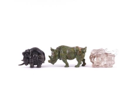 THREE CARVED HARDSTONE ANIMALS (3)Comprising: a rutilated quartz model of a hippo, 9cm long, a verdite rhino (losses), 12.5cm