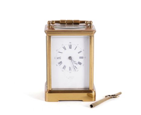 AN ENGLISH LACQUERED BRASS CORNICHE CARRIAGE CLOCKRoman hours and Arabic minutes, enamel dial inscribed A. F Godfrey Grantham