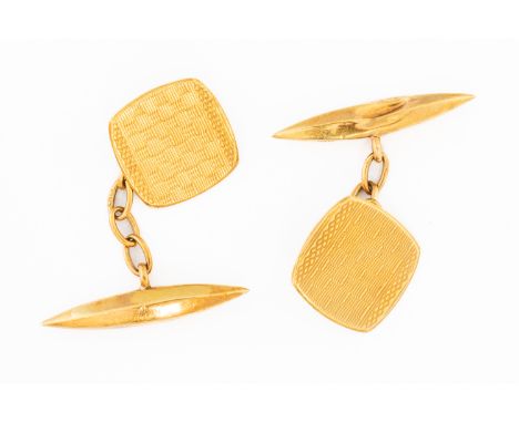 A PAIR OF 18CT GOLD CUFFLINKSThe curved square fronts engine turned, Birmingham 1929 and with hollow torpedo shaped backs, we