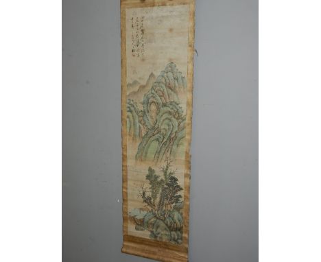 An early 20th century Chinese scroll, painted with a pagoda in a mountainous landscape, bears Chinese verse and artist's seal