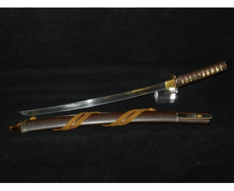 A Japanese 19th century copy of an earlier wakizashi and Kozuka, with original fittings, the brown lacquer scabbard with appl