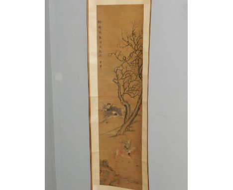 A 19th century Chinese watercolour painted scroll, depicting two figures riding horses in a courtyard scene. H: 125cm W: 31cm