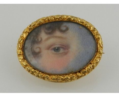A Victorian lover's eye miniature portrait brooch, of oval form, mounted within a yellow metal mount.