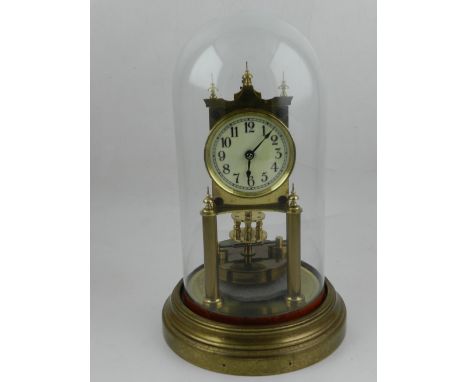 An early 20th century Gustav Becker brass anniversary clock, the enamel dial with Arabic numerals and outer minute track, rai